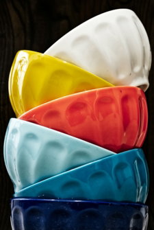 six assorted-colored bowls